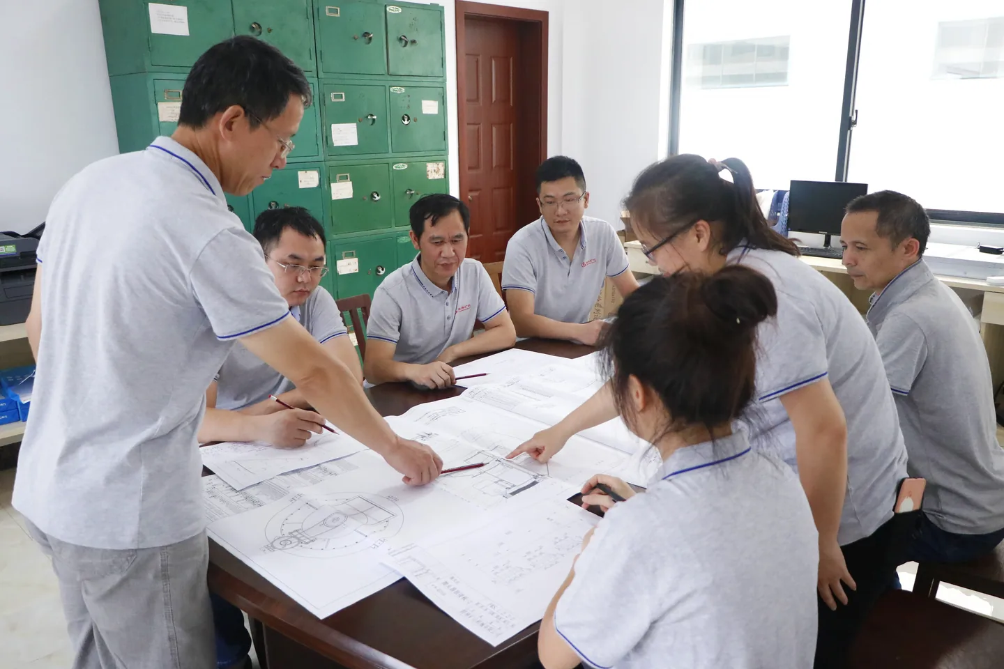 Cronus engineers reviewing calcite grinding mill flow sheet